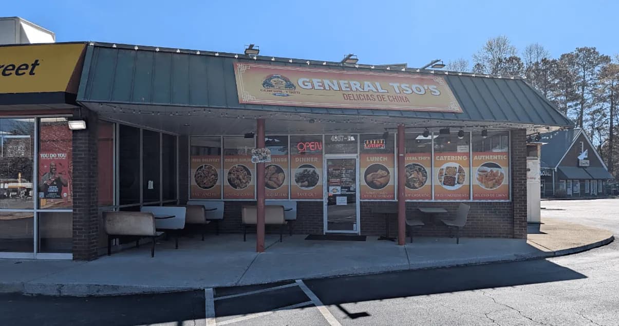 General Tso's Restaurant & Catering storefront in Dunwoody, Georgia, with its yellow sign and menu photos in the windows