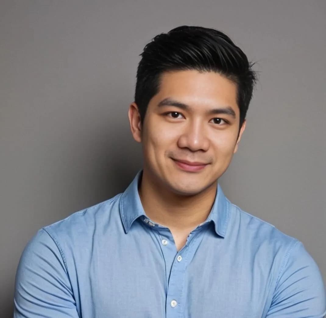 Portrait of Patrick Cheng, Director of Operations at NextGen Impact Georgia, smiling in a light blue shirt